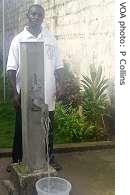 A Monrovia resident fetches water, Wednesday, 29 Aug. 2007