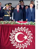 Turkey's new President Gul, center, PM Erdogan, right, and Chief of Staff Gen. Buyukanit, left, sing national anthem as they watch a military parade on the Victory Day in Ankara, 30 Aug 2007
