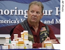 Vietnam veteran and Deputy Commander for Blue Mountain Veteran Coalition, Ron Fry, seated behind medicine bottles testifies during a Senate hearing on mental healthcare needs of service affairs members and veterans, Tacoma, Wash., Friday, 17 Aug. 2007