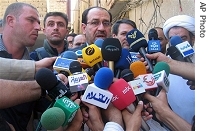 Prime Minister Nouri al-Maliki, center, addresses the media after meeting with Grand Ayatollah Ali al-Sistani, Wednesday, 05 Sept. 2007