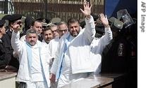 Muslim Brotherhood's third-highest ranking member, and a main financier Khayrat al-Shater (R-front) leads a group of detained members of the banned movement at their arrival to the Court House in Cairo 28 February 2007
