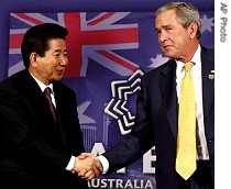 President Bush and South Korean President Roh Moo-hyun shake hands at the end of their meeting in Sydney, 7 Sep 2007