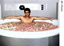 Bollywood actor Shah Rukh Khan is seen lying in a bathtub filled with pink and red rose petals in a first-ever promotional campaign for Lux beauty soap 