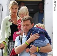 Kate and Gerry McCann, with twins Sean and Amelie, arrive at East Midlands airport in England, 09 Sep 2007