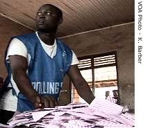 Poll workers count votes after the close of the polling stations