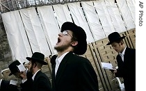 Ultra-Orthodox Jewish men pray at Western Wall, Judaism's holiest site, in Jerusalem's Old City, 12 Sep 2007