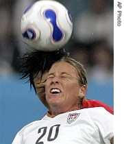 USA's Abby Wambach, front, fights for the ball against North Korea's Ri Kum Suk during their Group B World Cup match, 11 Sept. 2007