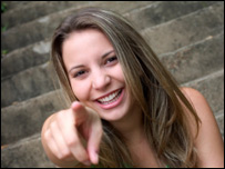 A girl laughing and pointing