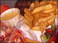 lobster, steak, chips, salad and mayonaise