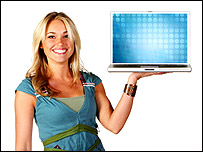 A woman holding a lap top