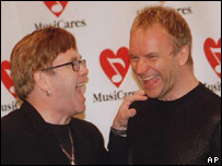 Elton John shares a joke with Sting