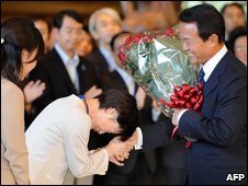 Outgoing PM Taro Aso leaves office