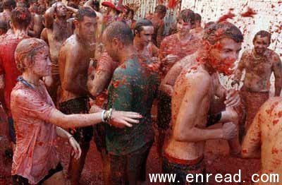 Revelers throw tomatoes during the annual 'tomatina' tomato fight fiesta in the village of Bunol, near Valencia, Spain, Wednesday, Aug. 25, 2010.