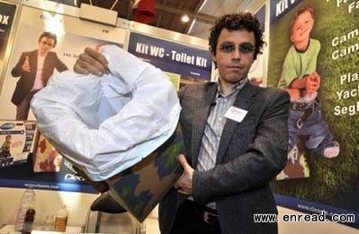 France's Laurent Helewa poses with his invention, a toilet kit, during the opening day of the 39th International Exhibition of Inventions, on April 6 in Geneva.