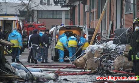 Rescue workers on the scene of the fire in Prato. Photograph: Xinhua/Landov/Barcroft Media