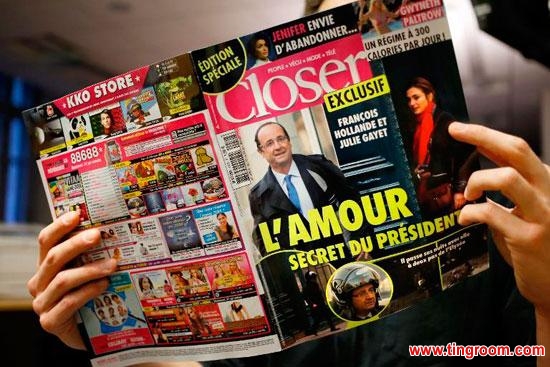 A man reads a copy of the Friday edition of French magazine Closer in Paris on January 10, 2014, which carried a seven-page report on President Francois Hollande's alleged infidelity.