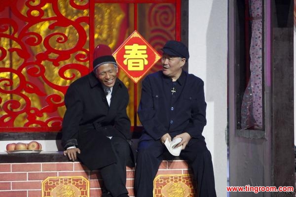 Zhao Benshan performs in his trademark blue hat and Sun Yat-sen suit.
