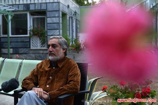 Afghan presidential candidate Abdullah Abdullah talks during an interview with media at his residence in Kabul on April 24, 2014.