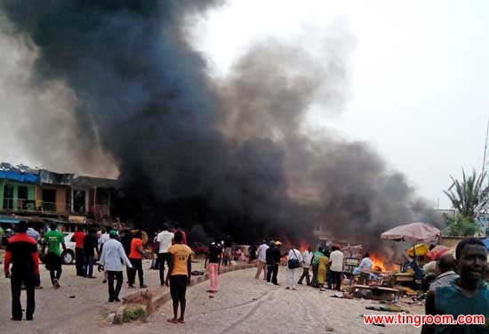 Smoke rises after a bomb blast at a bus terminal in Jos, Nigeria, Tuesday, May 20, 2014.