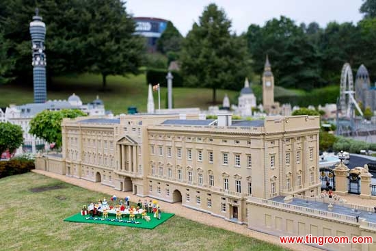 The in-scale party scene is dwarfed by the Palace.