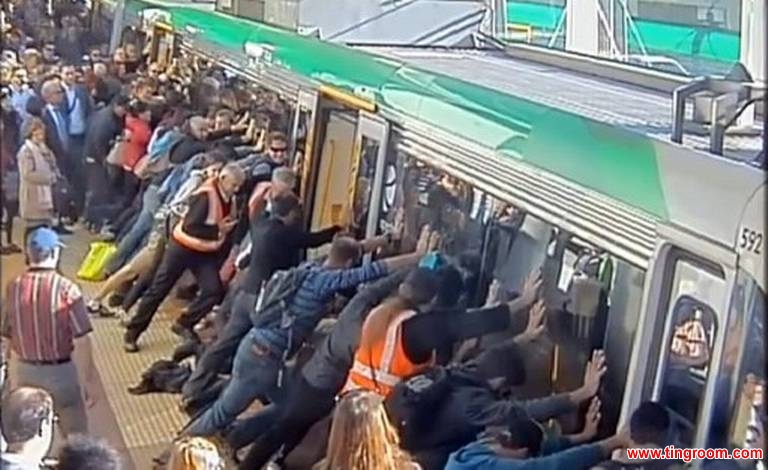 Passengers in Perth pushed train to free man
