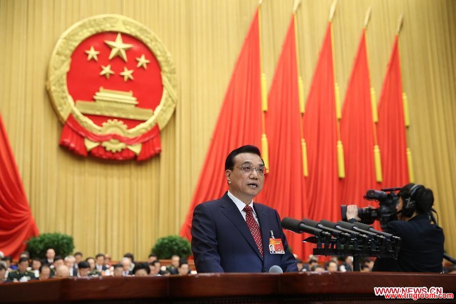 Chinese Premier Li Keqiang delivers the government work report during the opening meeting of the third session of China