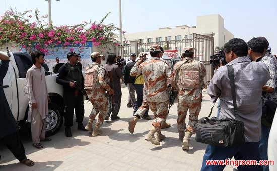 Pakistani rangers arrive at a hospital where the bodies of victims are shifted in southern Pakistani port city of Karachi, May 13, 2015. At least 43 people were killed and 13 others were injured when unknown gunmen opened fire at a passenger bus carrying about 60 to 65 people of a minority group in Pakistan
