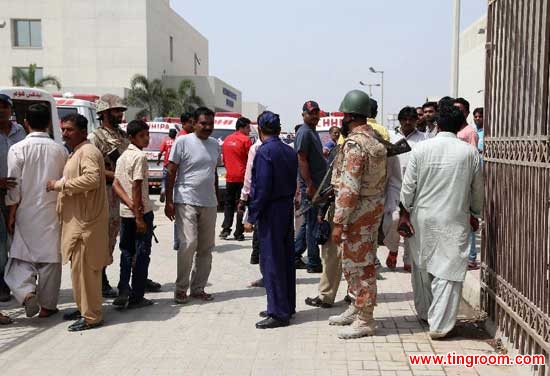 Pakistani rangers stand guard outside a hospital where the bodies of victims are shifted in southern Pakistani port city of Karachi, May 13, 2015. At least 43 people were killed and 13 others were injured when unknown gunmen opened fire at a passenger bus carrying about 60 to 65 people of a minority group in Pakistan