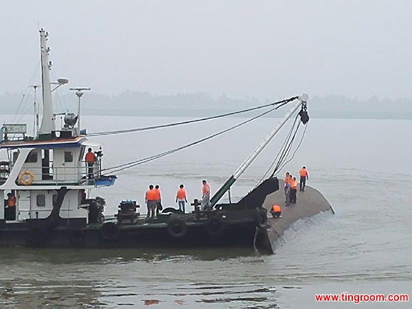 Rescuers work near the ship sinking site in the Jianli section of the Yangtze River in central China
