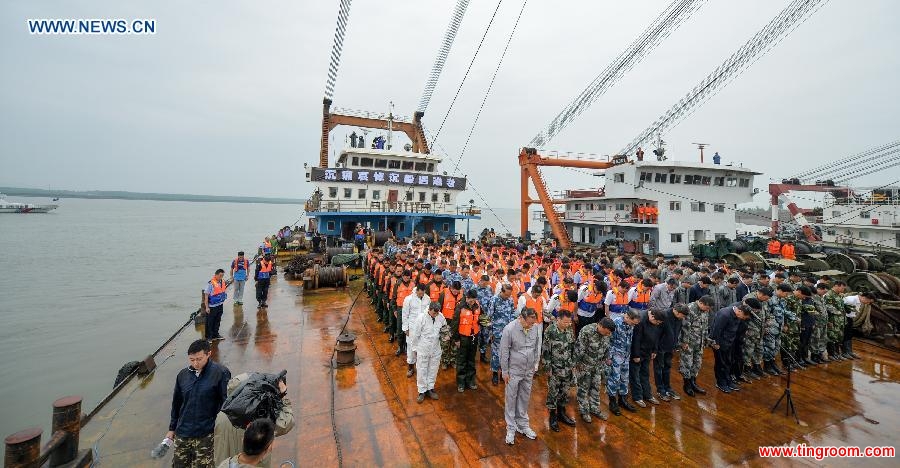 A mourning ceremony is held for 406 deceased people on the capsized ship Eastern Star at the sinking site in the Jianli section of the Yangtze River, central China