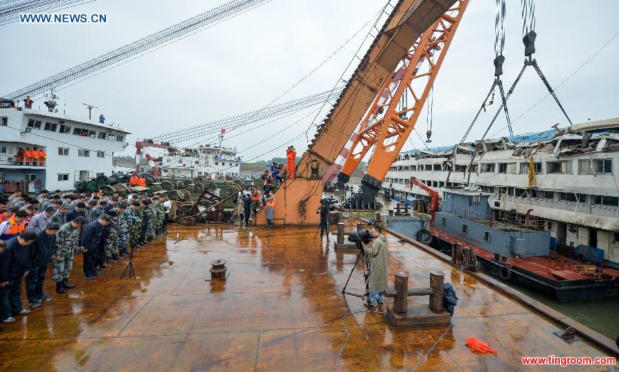 A mourning ceremony is held for 406 deceased people on the capsized ship Eastern Star at the sinking site in the Jianli section of the Yangtze River, central China