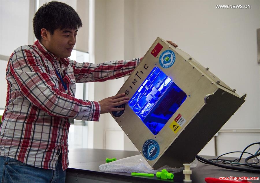 A micro-g 3D printer works in a tilting status at a research center in southwest China