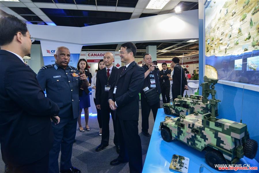 Deputies of Chinese defense companies introduce Chinese military equipment to visitors at the 2016 Defence Services Asia (DSA) exhibition in Kuala Lumpur, capital of Malaysia, on April 18, 2016. Three Chinese companies, Poly Technologies, China National Precision Machinery Import and Export Corporation (CPMIEC) and CETC International joined the Airbus and BAE systems in the 2016 Defence Services Asia (DSA) exhibition held in the Malaysian capital this week. (Xinhua/Chong Voon Chung)