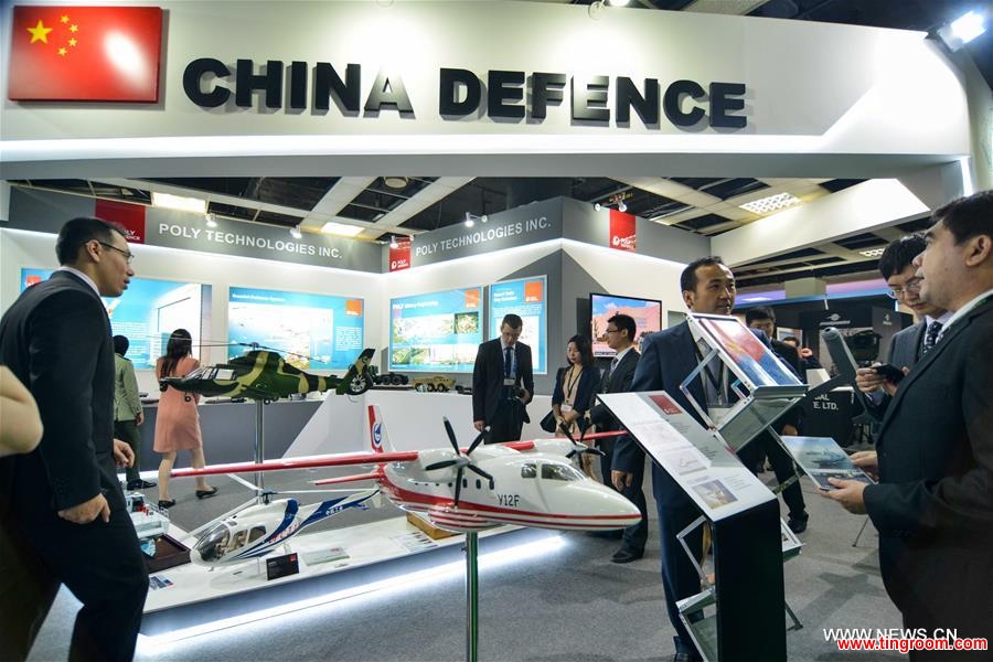 Visitors watch products in a China pavilion themed China Defence at the 2016 Defence Services Asia (DSA) exhibition in Kuala Lumpur, capital of Malaysia, on April 18, 2016. Three Chinese companies, Poly Technologies, China National Precision Machinery Import and Export Corporation (CPMIEC) and CETC International joined the Airbus and BAE systems in the 2016 Defence Services Asia (DSA) exhibition held in the Malaysian capital this week. (Xinhua/Chong Voon Chung)