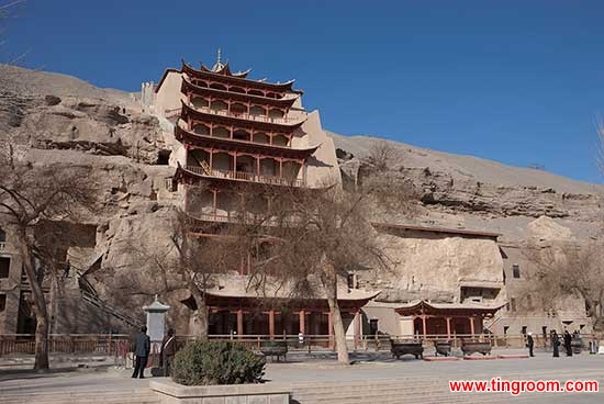 The nine-story temple (Cave 96) houses a colossal Tang dynasty Buddha statue some thirty-three meters high. Mogao Caves, Dunhuang, China. Dunhuang Academy.