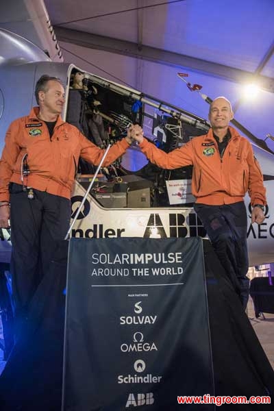 The file photo shows the two pilots of the Swiss-made Solar Impulse 2 in front of the airplane.