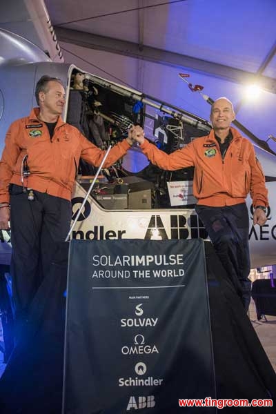 The file photo shows the two pilots of the Swiss-made Solar Impulse 2 in front of the airplane. 