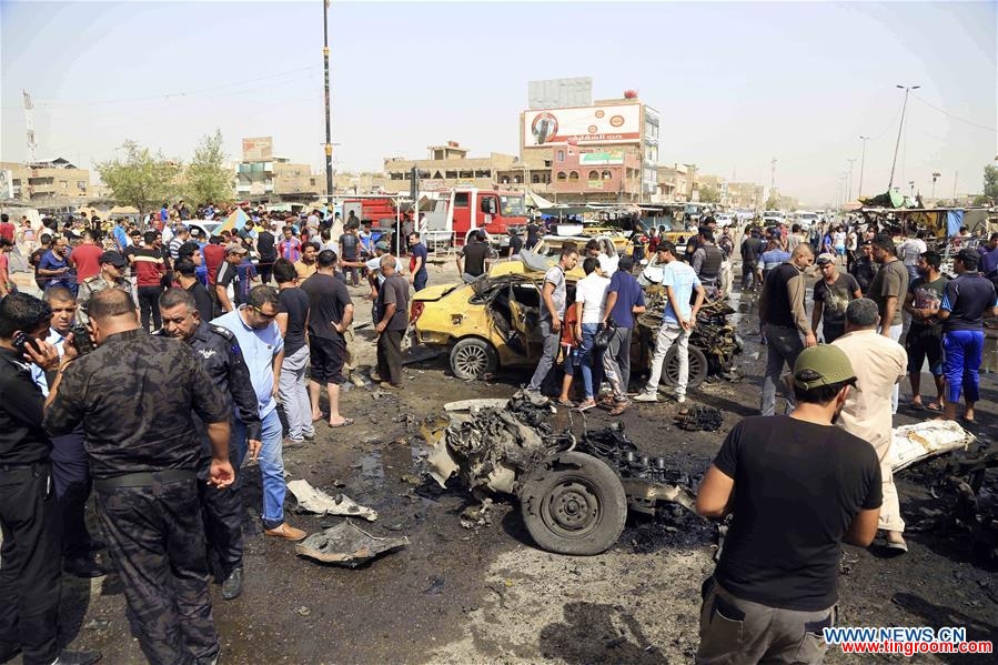  Security forces arrive at the explosion site after an attack killing around 16 people and wounding 53 others in Sadr City in eastern Baghdad, Iraq, on May 17, 2016. (Xinhua/Khalil Dawood) 