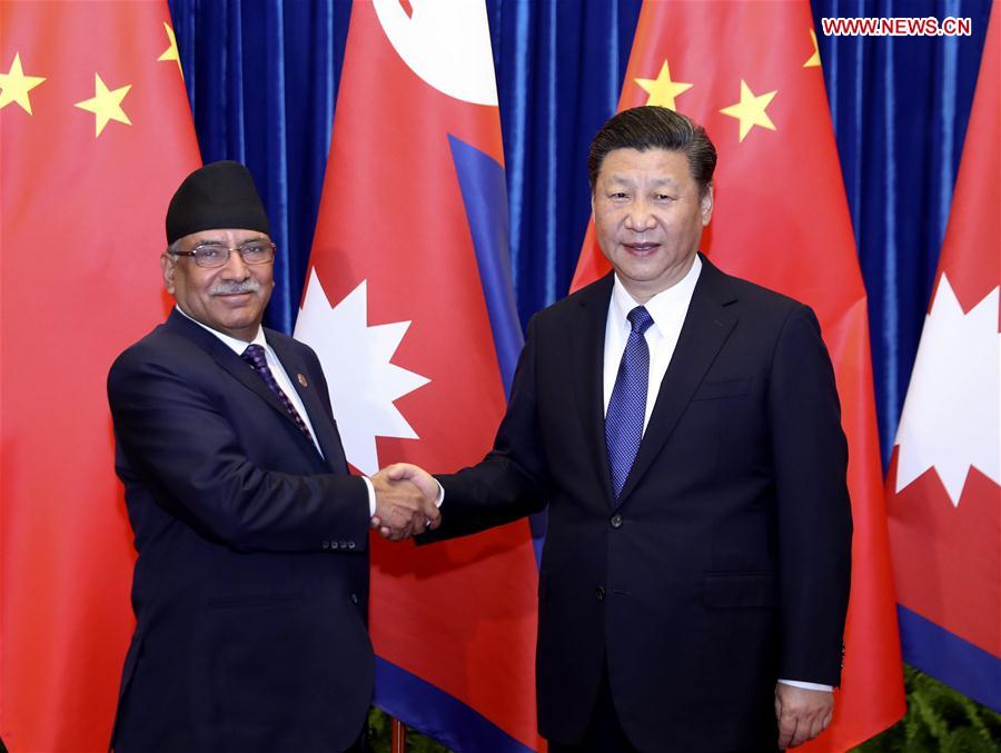 Chinese PresidentXi Jinping(R) meets with Nepali Prime Minister Pushpa Kamal Dahal in Beijing, capital of China, March 27, 2017.(Xinhua/Ding Lin)