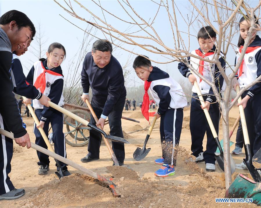 Chinese President Xi Jinping plants a sapling as he attends a tree planting activity in Beijing, capital of China, March 29, 2017. China